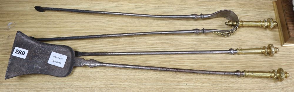 A set of three 19th century steel and brass tipped fire irons, length 68cm